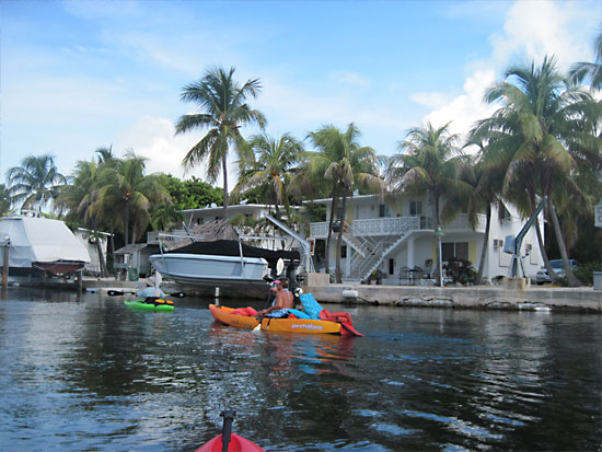 Kayaking among waterfront homes